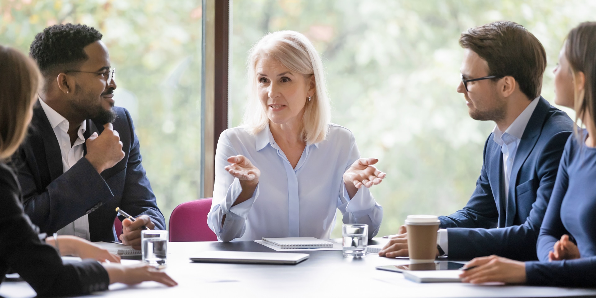 Woman in a meeting with her team