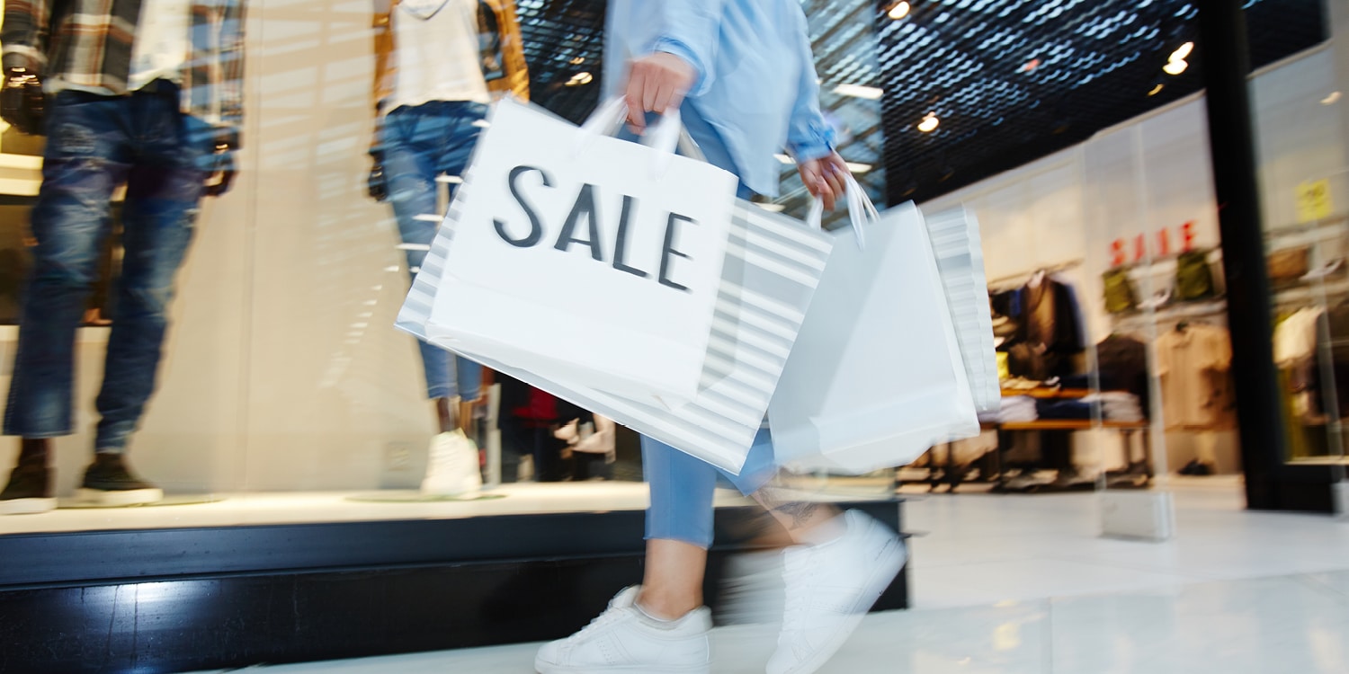 Retail shopper carrying sale items