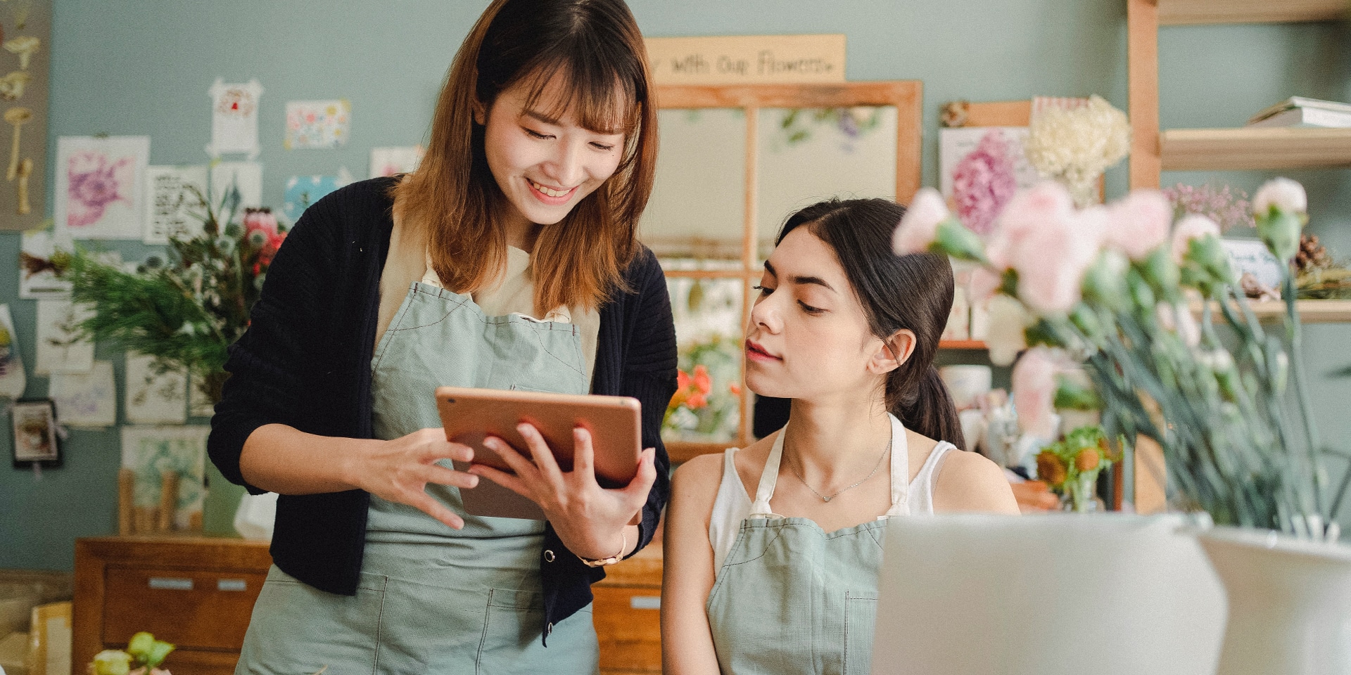 singapore women using tablet in their business