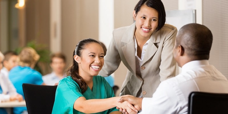 Hospital employee and nurse at job interview